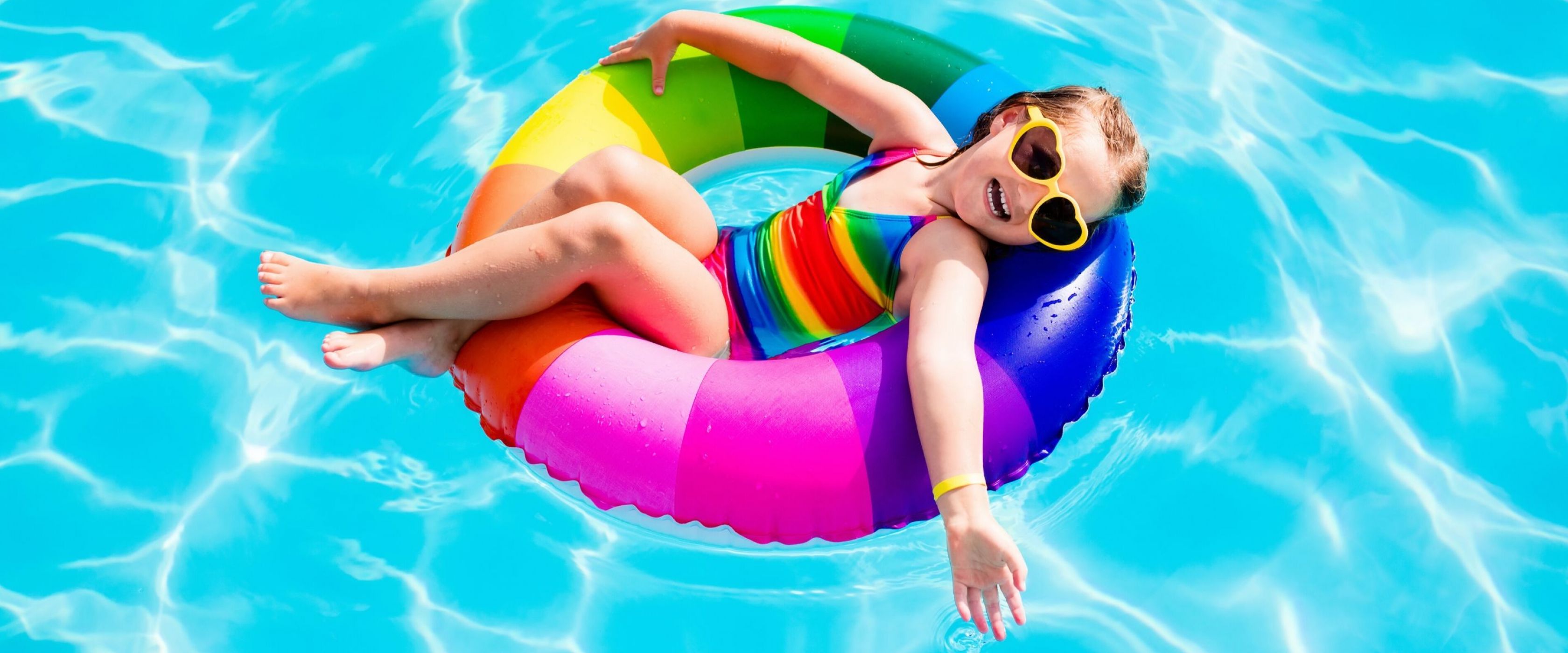girl floating in pool