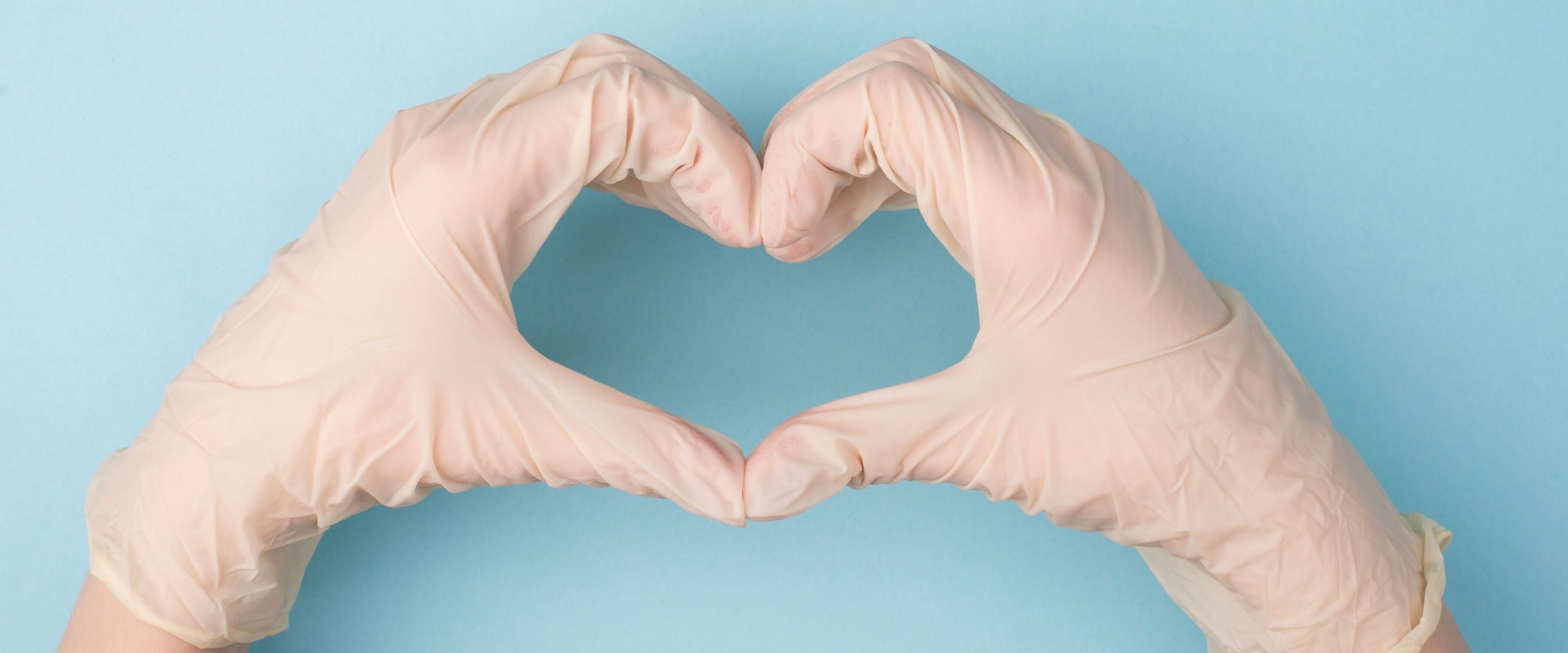 Wearing gloves making a heart