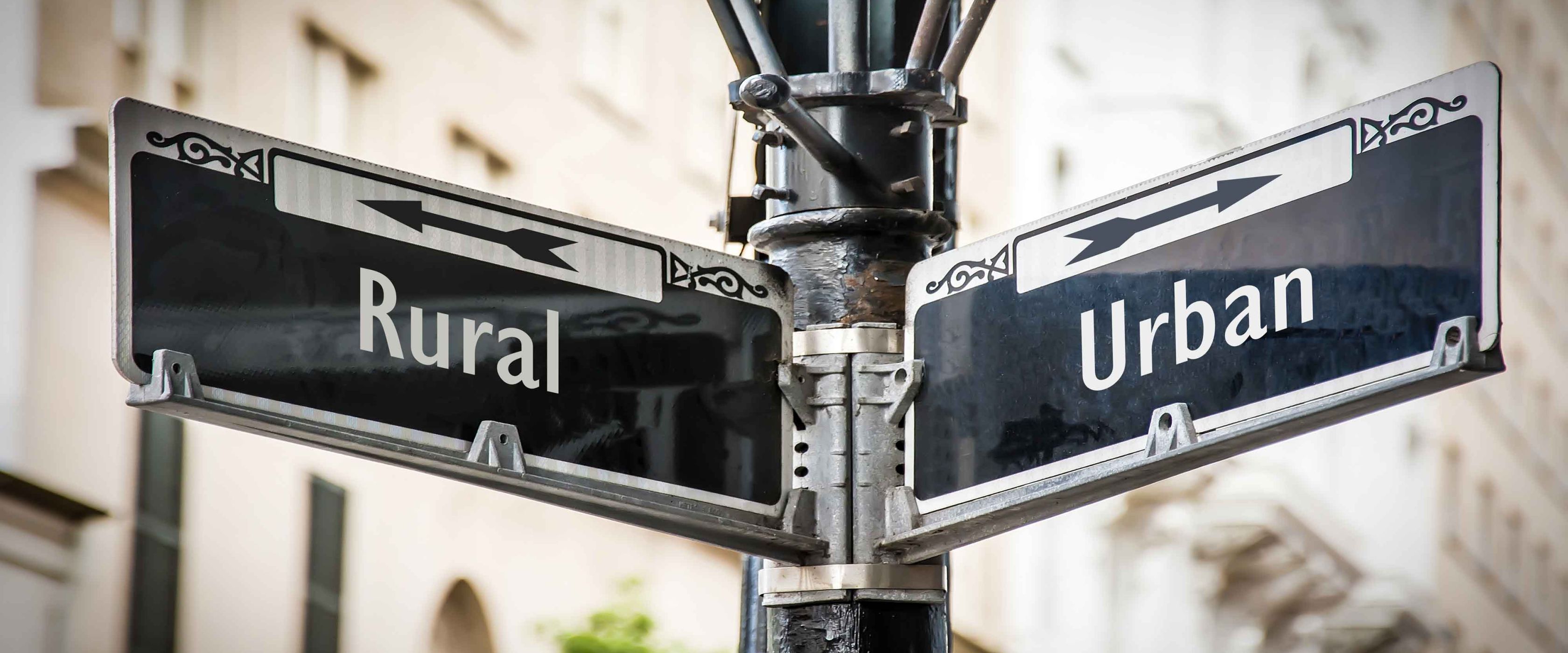 Street sign with both Urban and Rural directions