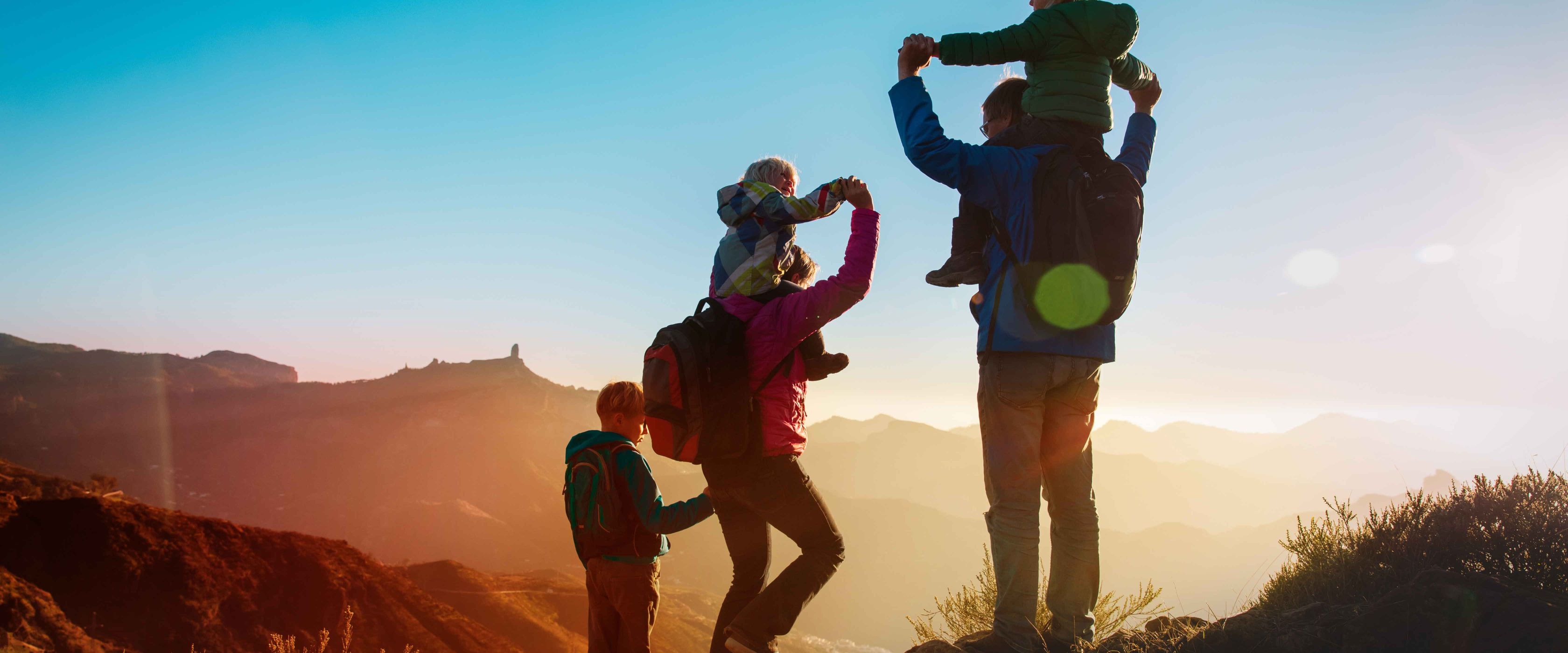 Mother and Father hiking with their kids