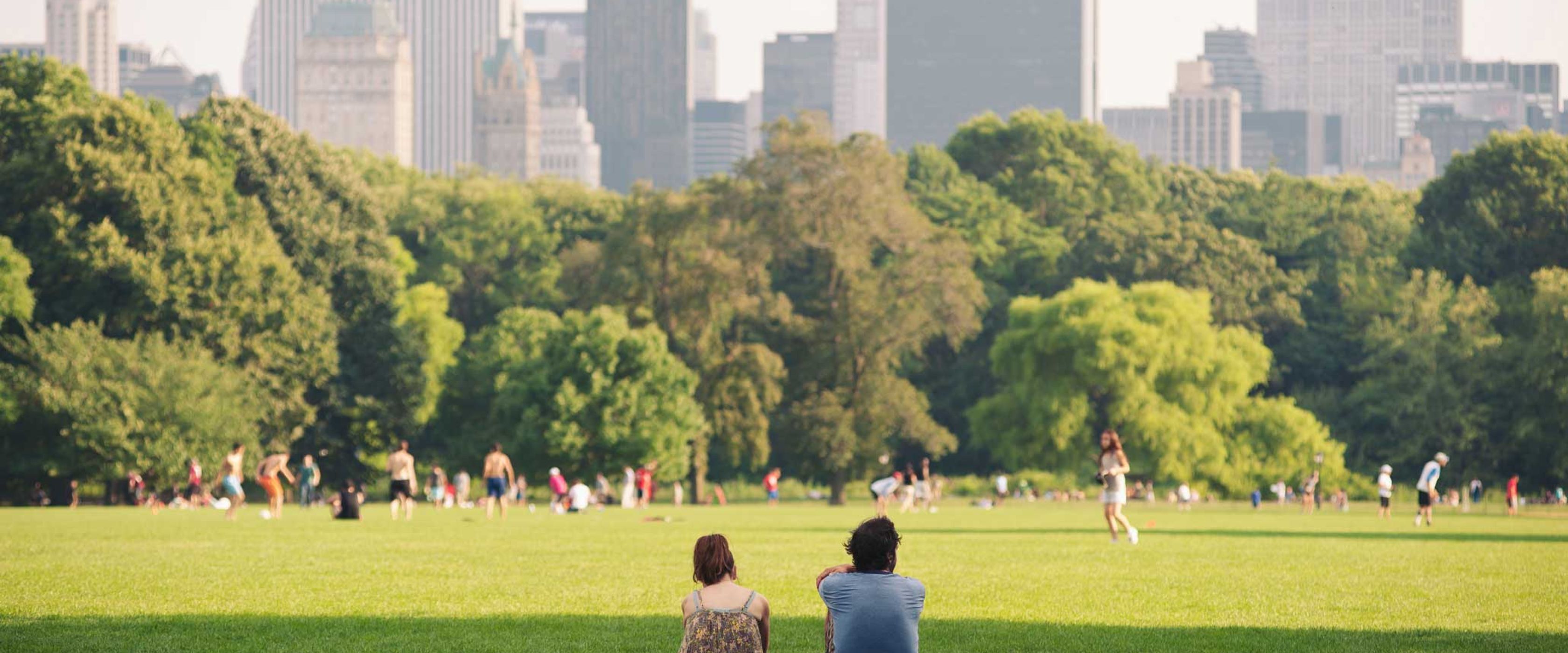 Two people sitting in Central Park NYC