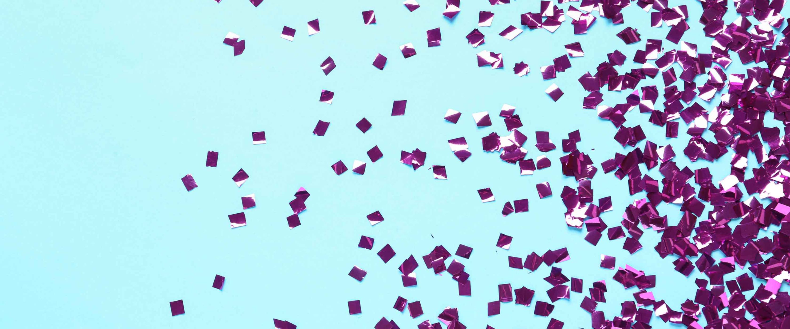 Purple confetti on blue background