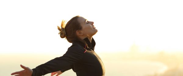 Woman holding out her arms