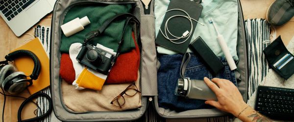 Person packing a suitcase