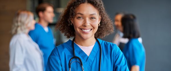 A clinician smiles