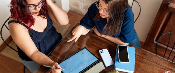 travel therapists reviewing certification details on a tablet, ready to advance their career.