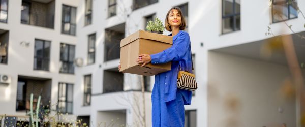 female with moving box