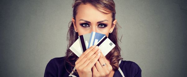 female holding a selection of credit cards