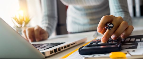 female calculating her taxes