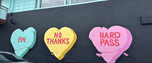 three hearts mounted on a wall showing no thanks, hard pass and EW.