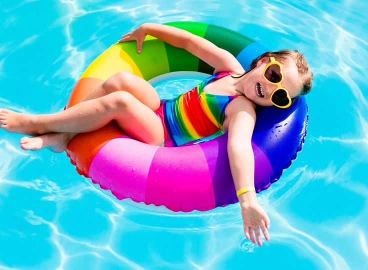 girl floating in pool