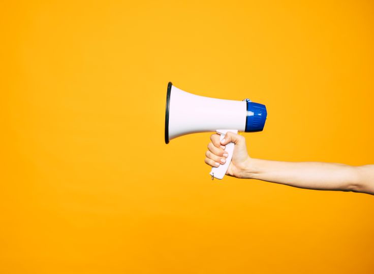 Megaphone on yellow background 