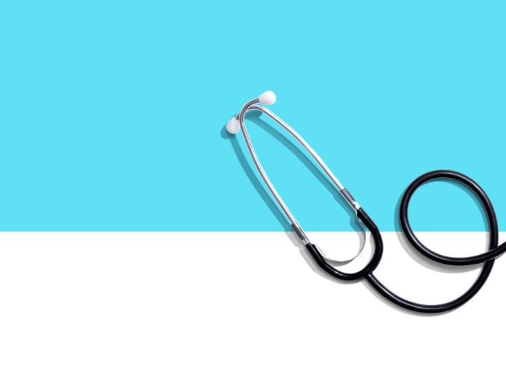 Stethoscope on blue background