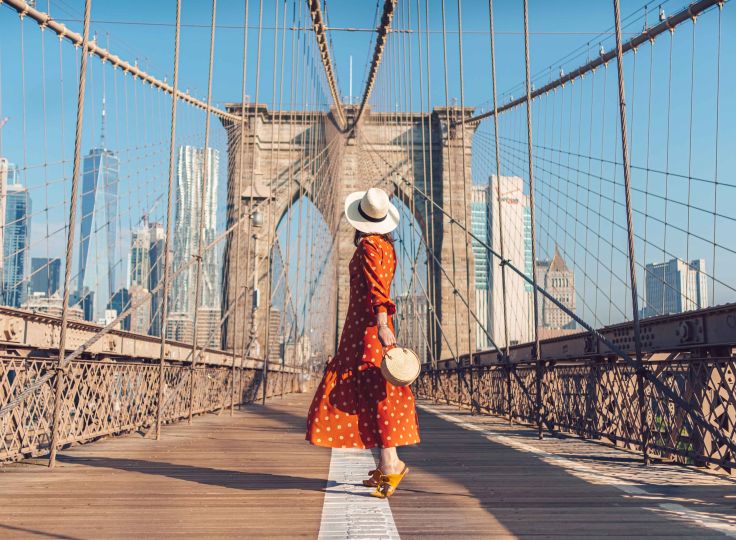 Woman standing on bridge