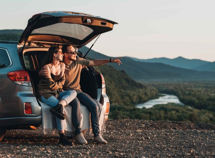 Two people sitting in a car 