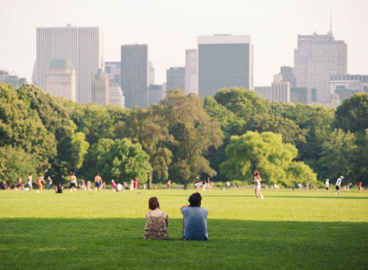 Two people sitting in Central Park NYC