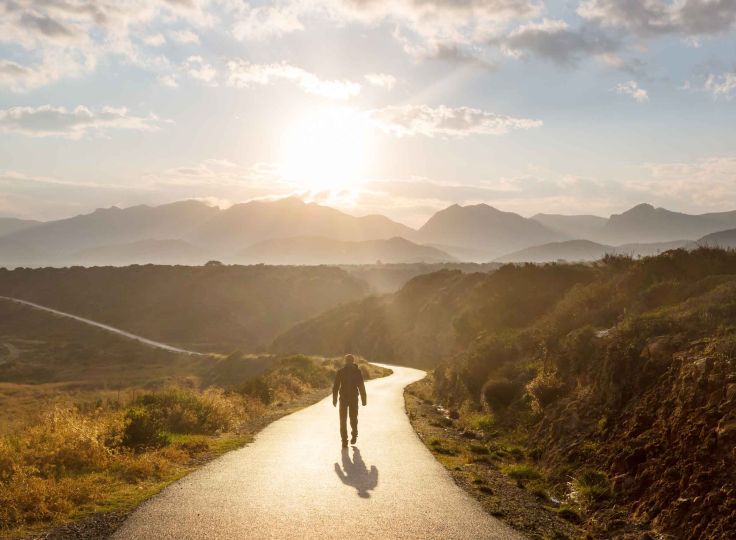 Person walking down a trail