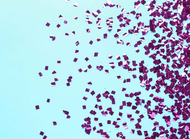 Purple confetti on blue background