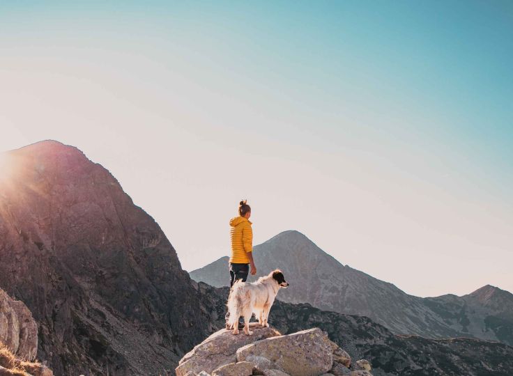 Woman and dog hiking