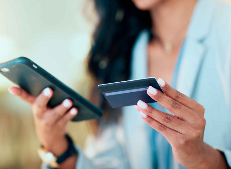 Woman holding a credit card