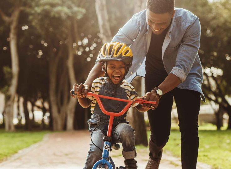 Man and child on a bike