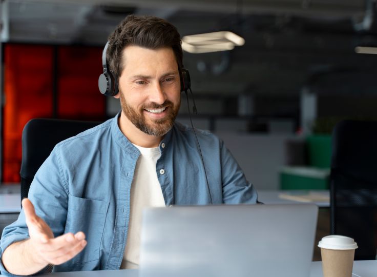 Recruiter at his desk talking to a clinician