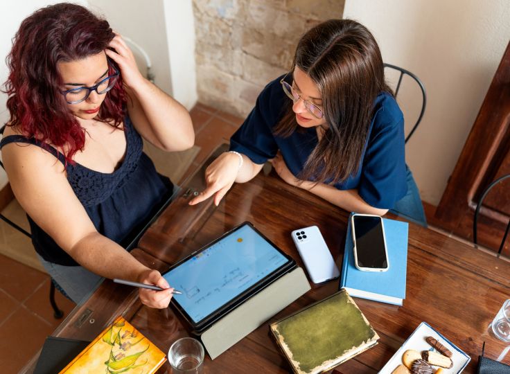 travel therapists reviewing certification details on a tablet, ready to advance their career.