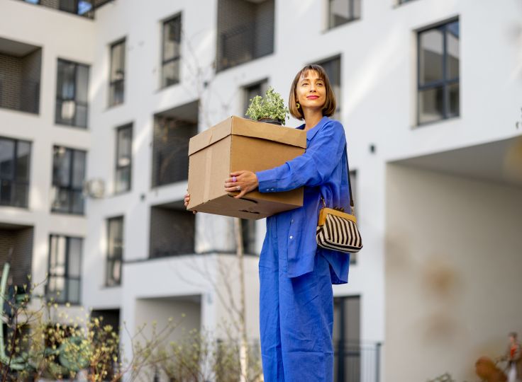 female with moving box