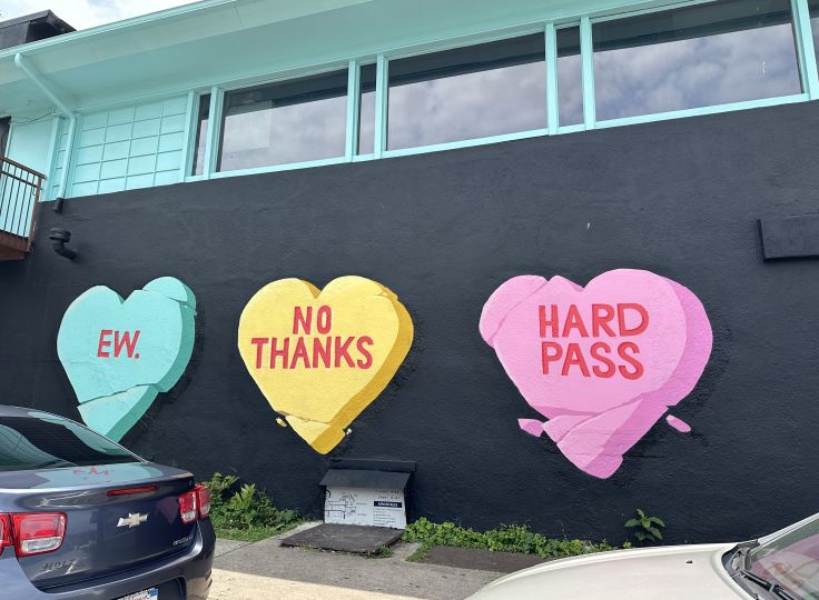 three hearts mounted on a wall showing no thanks, hard pass and EW.