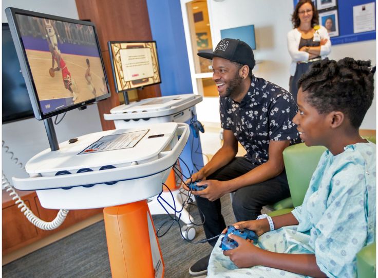 GO Karts child playing a game at the hospital