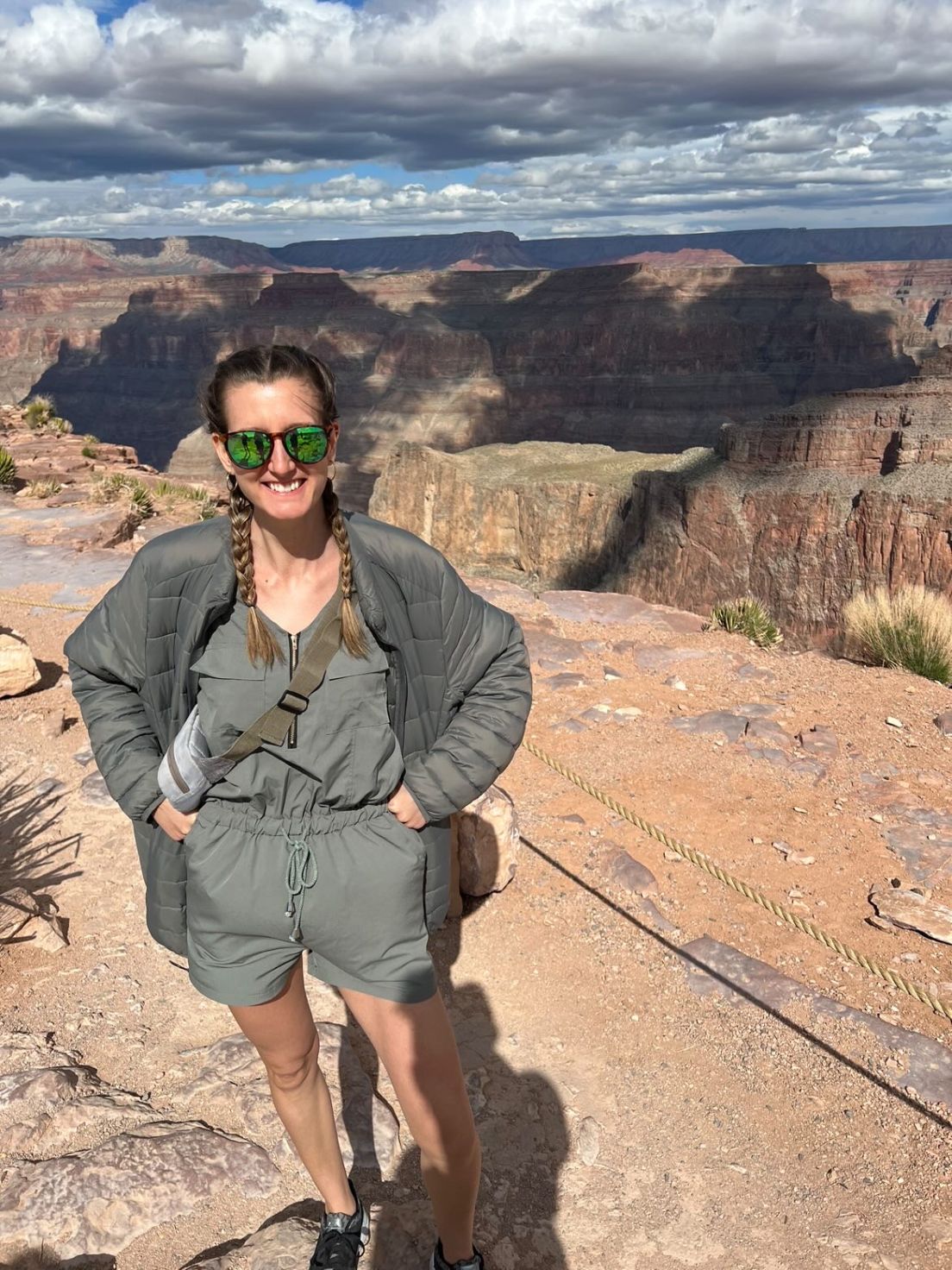 woman standing in front of grand canyon