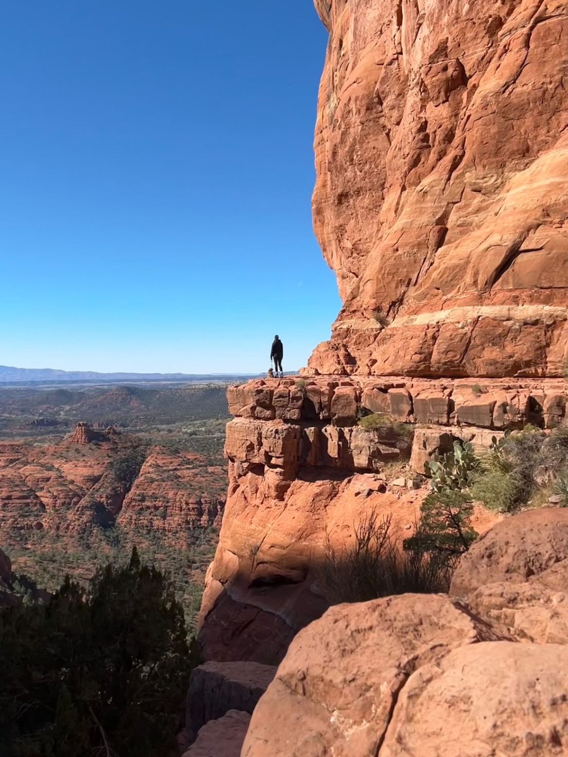 Person standing on a cliff