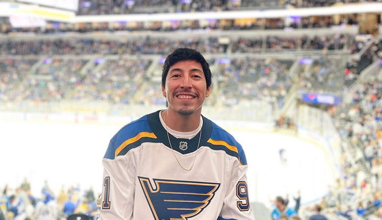 Man standing at hockey game