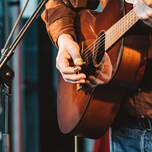 Person playing the guitar