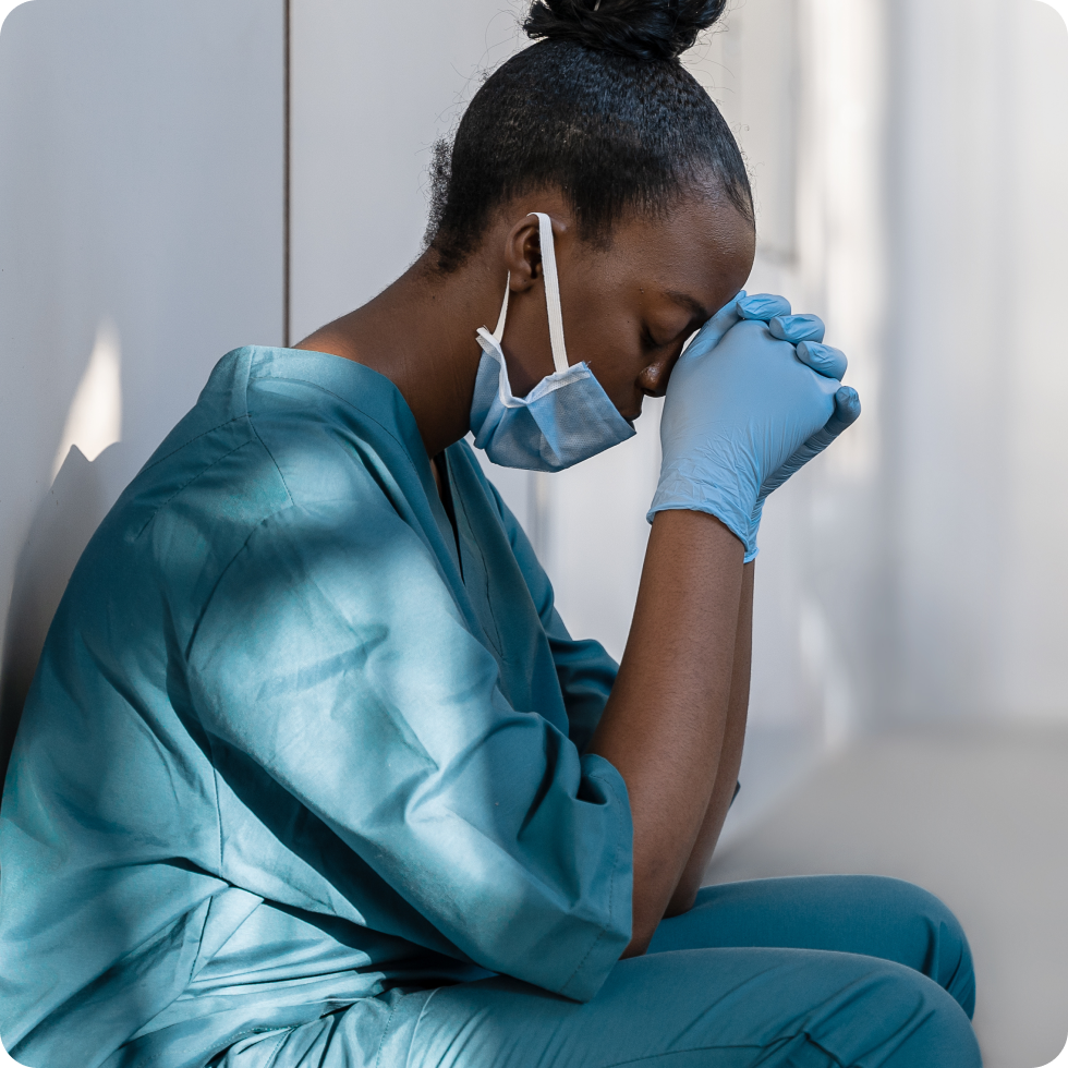 A clinician takes a moment to think