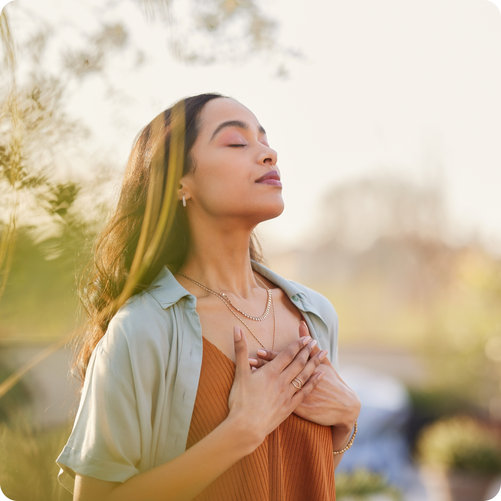 A clinician focuses on their breathing as they meditate 