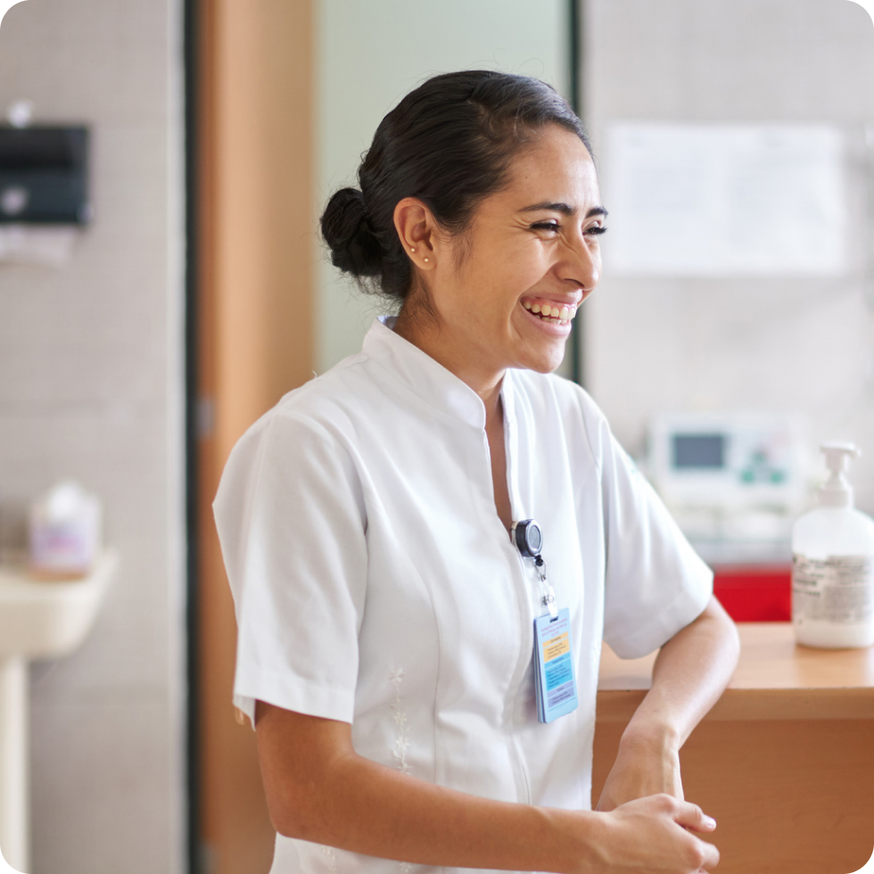 A smiling travel allied clinician