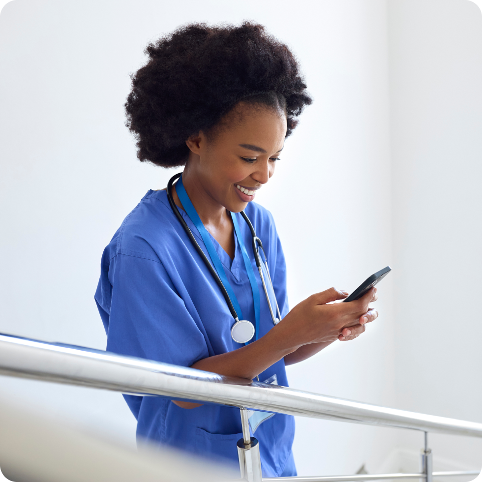 A clinician checks their mobile app for new travel nursing locations