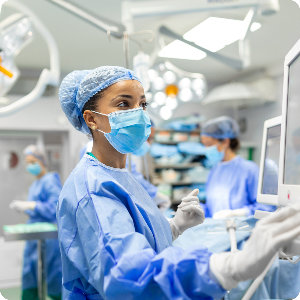A medical technologists monitors the patient during a procedure