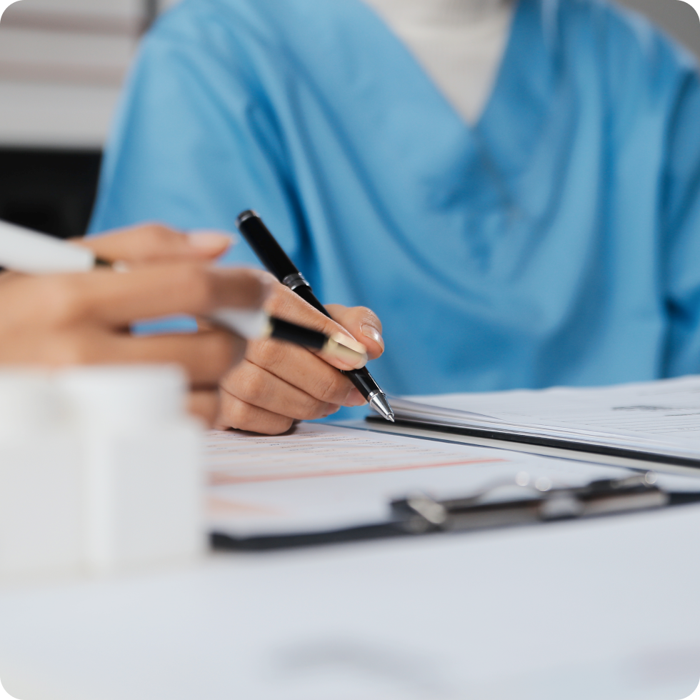 A clinician takes patient notes