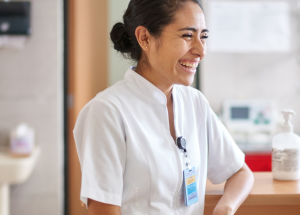 A smiling travel allied clinician