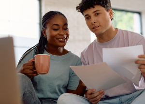 A clinician and their partner work on their budget