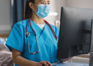 A clinician updates patient records
