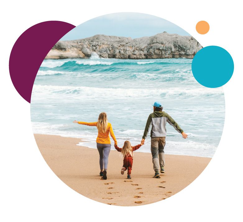 Family holding hands on the beach